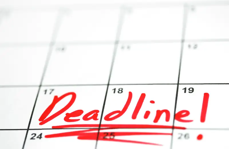 a close up of a calendar with the words deadline written in red highlighting a deadline for a construction project in dispute