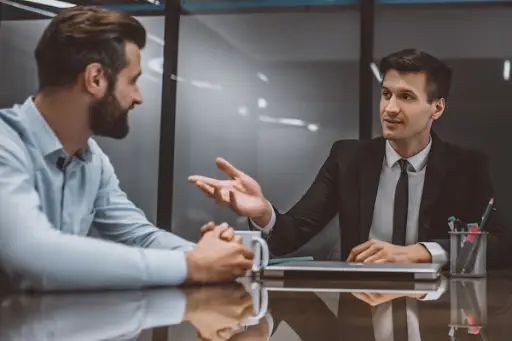 Client talking to a civil litigation lawyer about his case during a consultation.