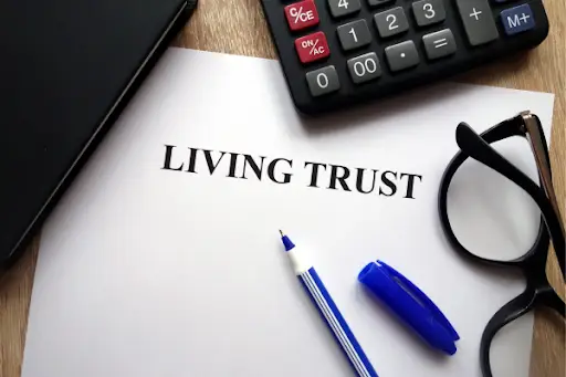 Documents for a living trust being examined by a lawyer.