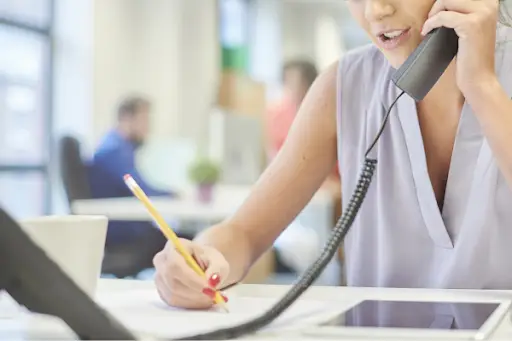 An executor of a will communicating over the phone with a beneficiary of the will.