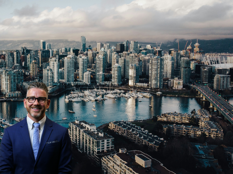 Construction lawyer Mike Stewart standing in front of a cityscape of Downtown Vancouver British Columbia Canada