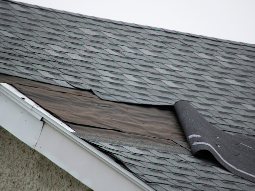 roof shingles peeling off due to substandard craftsmanship from a contractor